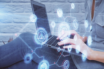 Double exposure of woman hands working on computer and data theme hologram drawing. Tech concept.