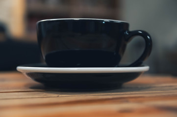 black coffee Cup photographed from the bottom.