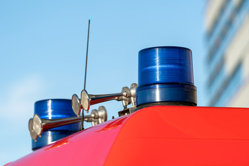 Flashing lights and signal horns on top of a fire truck