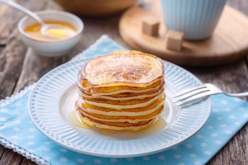 Pancake for breakfast in a blue plate.