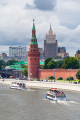 View of the Kremlin Embankment with a two pleasure ships sailing along the river 