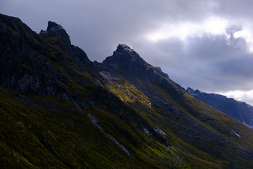 Fototapeta na wymiar Lofoten Islands, cloudy landscape with mountain and sea views