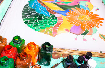 paints and silk canvas with floral batik pattern