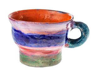 handmade and handpainted mug from clay isolated