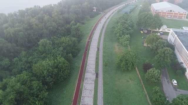 Novosadski kej. Early morning. Fog. Man jogging. Birds-eye view. Aerial footage
