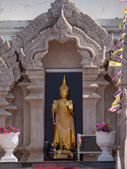 The golden Buddha statue stands in the frame.