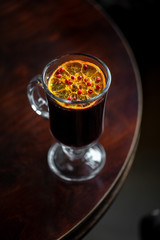 Mulled wine standing on the table. Night club scenery.