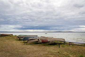 The upturned boats on the shore of the lake Driviaty, Braslav district in Belarus