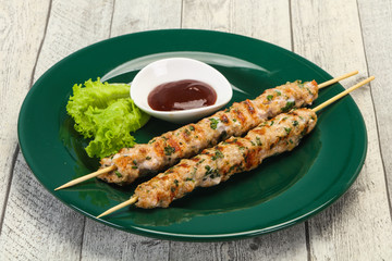 Minced pork skewer kebab with sauce