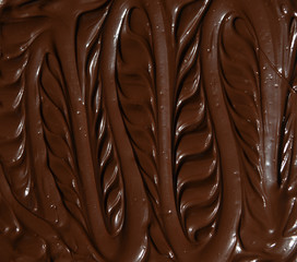 molten milk chocolate with wavy patterns