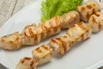 Grilled pork skewer served salad