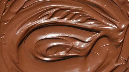 molten milk chocolate with wavy patterns