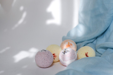 aromatic bomb bombs for a bath on a light background. Spa therapy. Body cosmetics. Aromatherapy...