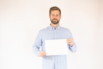 handsome young man in blue shirt with paper