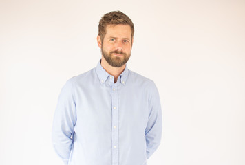 Fototapeta premium handsome young man in blue shirt looking into the camera