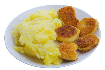 Boiled mashed potatoes on a plate with chicken nuggets on white background