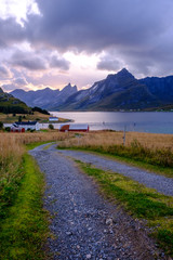 village road to home in norway among fjords and bay