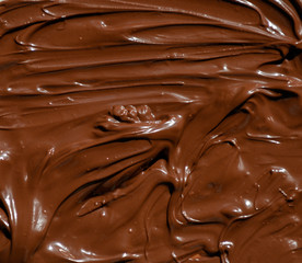 molten milk chocolate with wavy patterns