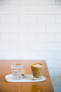 Cafe cortado and glass of water