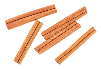 Cannelle. Cinnamon sticks isolated on white background, top view.