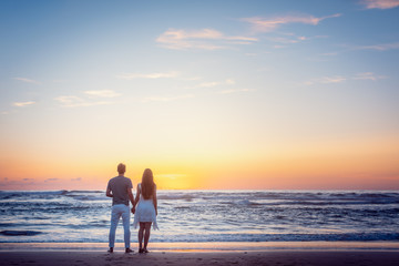 Romantic couple holding hands in their vacation