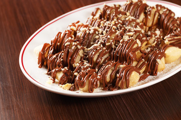 Nutelinne. Traditional Italian dessert with Nutella chocolate sauce and sweet dough. Coming with cappuccino. Tasty dessert