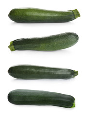 Set of fresh ripe zucchinis on white background