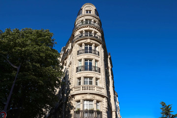 Traditional French house with typical balconies and windows. Paris.