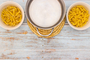 Various kind of pasta served on table with cutlery