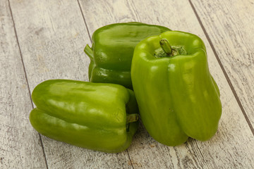 Three green bell juicy peppers