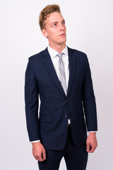 Young handsome Scandinavian businessman against white background