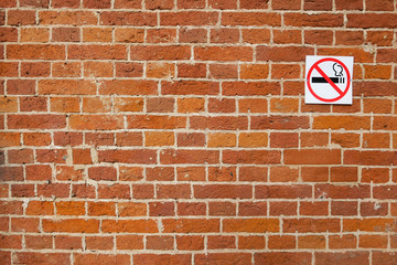 Three- dimensional elements of brickwork on the wall. Terraces on an old brick wall. Old weathered...