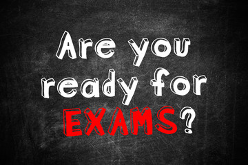 Obraz premium Black chalkboard with phrase ARE YOU READY FOR EXAMS as background