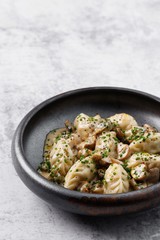 Dumplings with rabbit meat. Rabbit pelmeni with truffle oil. Hiqh quality photo. Best for promotion. Marble table.  Close-up and top view. Flat lay