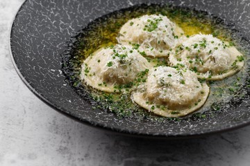 Ravioli porcini with champignons. Italian dumpling. Hiqh quality photo. Best for promotion. Marble table.  Close-up and top view. Flat lay