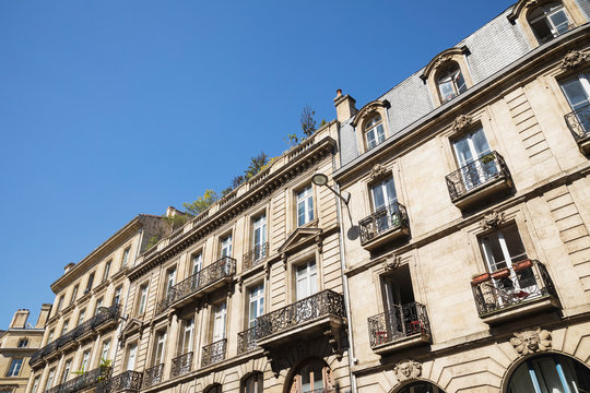 France, Gironde, Bordeaux, Low angle view of windows and balconies of old town residential buildings