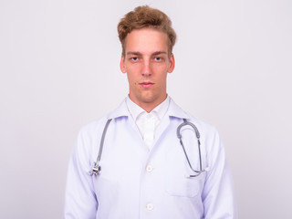 Young handsome Scandinavian man doctor against white background