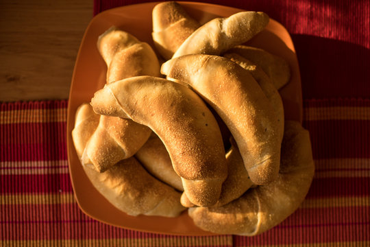 Hand made bread rolls with golden crust just out of oven