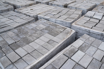Fototapeta premium concrete paving stones, folded pile of stone for laying the track