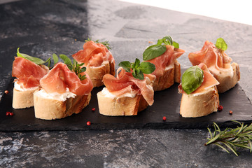 Iberico ham sandwich with homemade bread baked in wood oven or jamon sandwich with local herbs