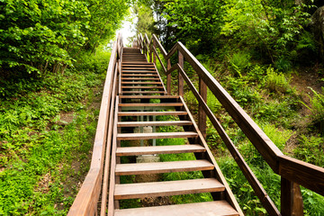 wooden steps with railing up in the pedestrian zone