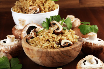 risotto with mushrooms, fresh herbs and cuisine parmesan cheese.