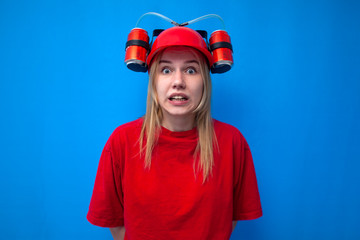 shocked funny girl fan in red uniform and beer hat is rooting for her team, cheerleader in stress