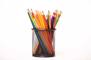 colored pencils in a glass