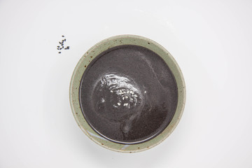 Top view of a bowl of black sesame seeds paste