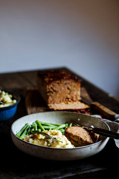 Plate of mashed potatoes with green beans and meat loaf