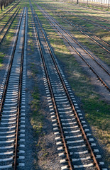Fototapeta premium Panoramic view of many rusty railroad tracks. Top view.