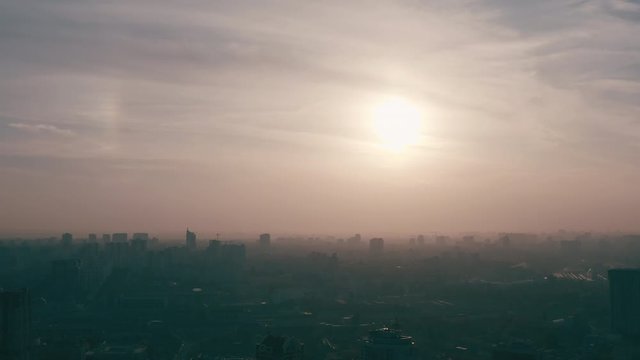 silhouette of a roof spire, lightning rod in a skyscraper. against the backdrop of sunset and evening city center