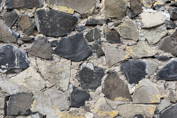 Texture of a stone wall as background.