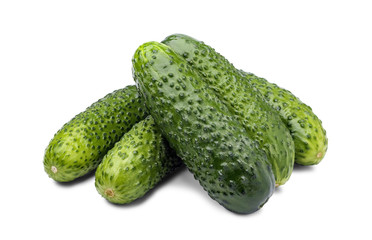 Pile of fresh cucumbers isolated on white background.